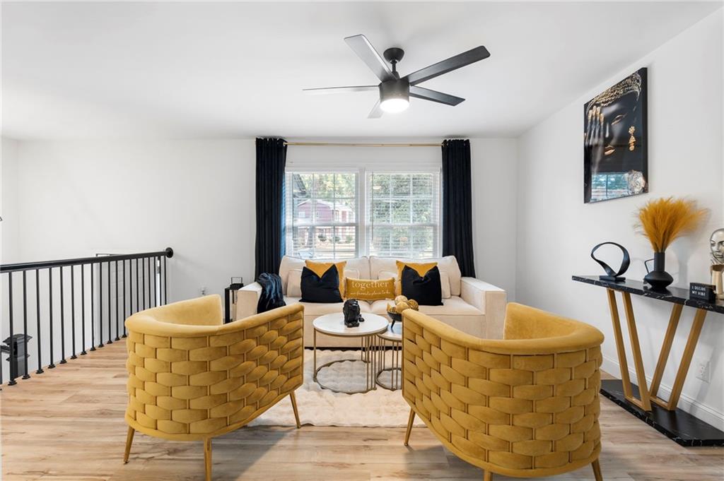 1969 Valley Ridge Drive Southwest Atlanta, GA 30331 - Photo 11 of 37 a living room with fireplace furniture and a large window
