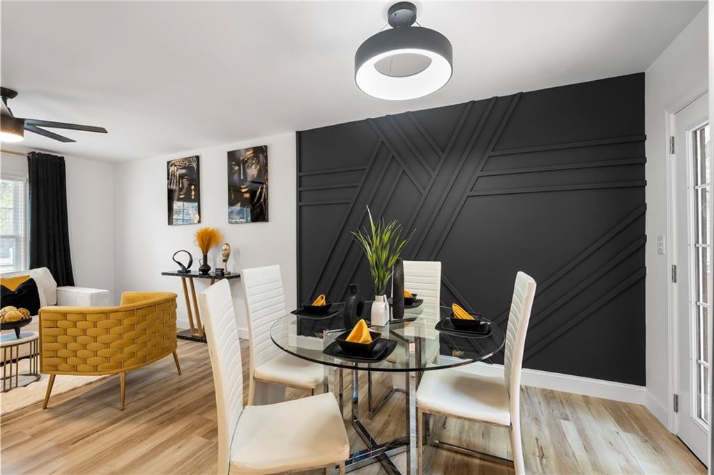 1969 Valley Ridge Drive Southwest Atlanta, GA 30331 - Photo 13 of 37 a dining room with furniture and a floor to ceiling window