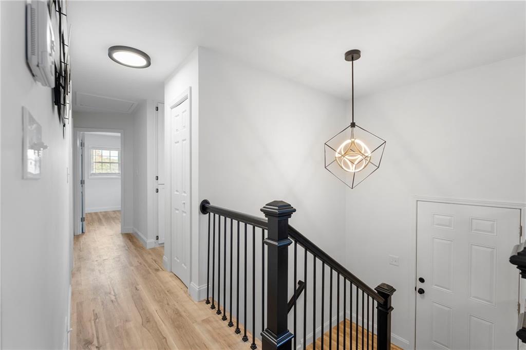 1969 Valley Ridge Drive Southwest Atlanta, GA 30331 - Photo 19 of 37 a view of a hallway with a chandelier