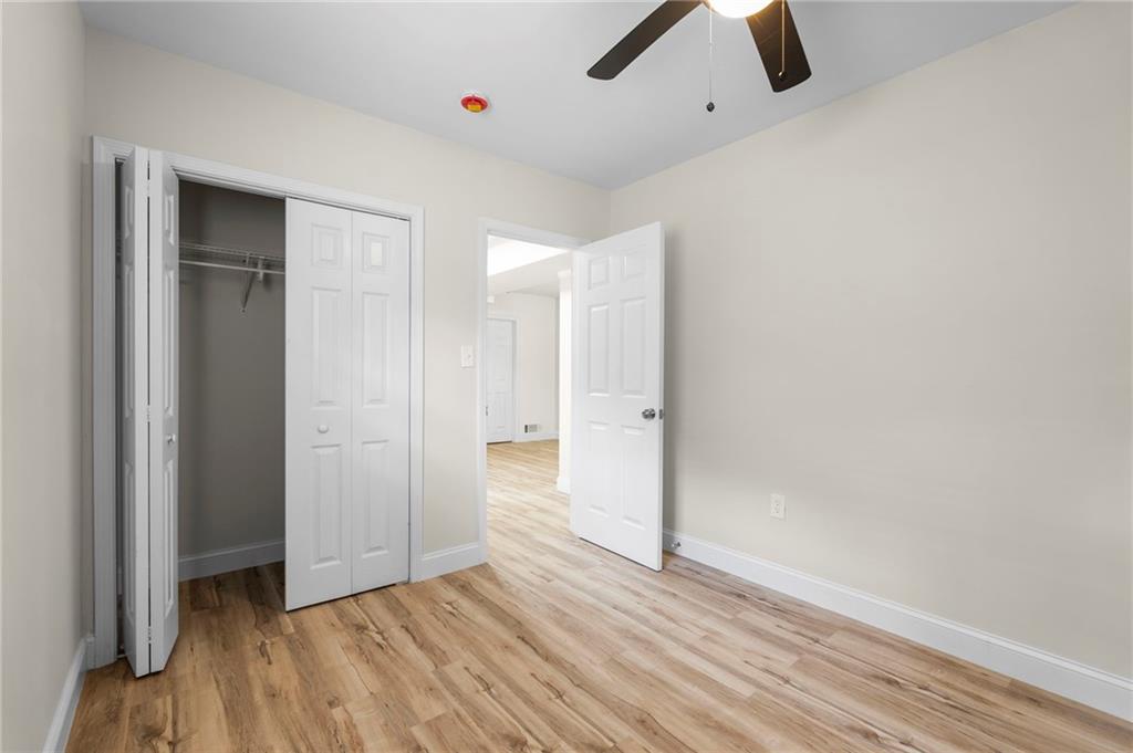 1969 Valley Ridge Drive Southwest Atlanta, GA 30331 - Photo 34 of 37 wooden floor in an empty room