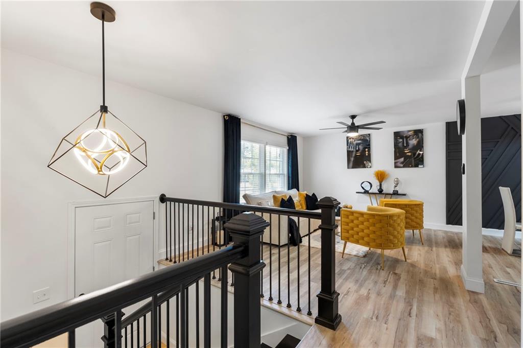 1969 Valley Ridge Drive Southwest Atlanta, GA 30331 - Photo 6 of 37 a view of a livingroom with furniture wooden floor windows and a chandelier