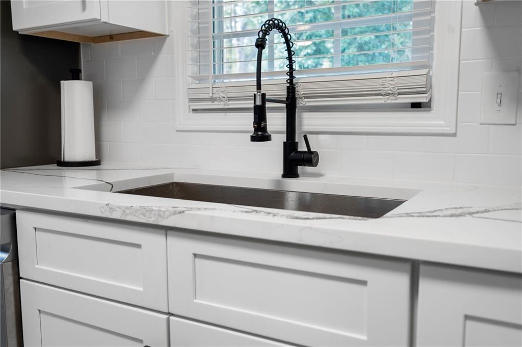 1969 Valley Ridge Drive Southwest Atlanta, GA 30331 - Photo 7 of 37 a kitchen with a sink and a window