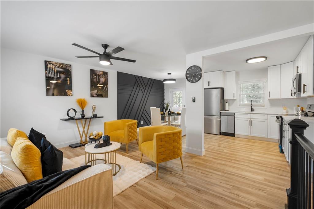 1969 Valley Ridge Drive Southwest Atlanta, GA 30331 - Photo 8 of 37 a living room with furniture and kitchen view