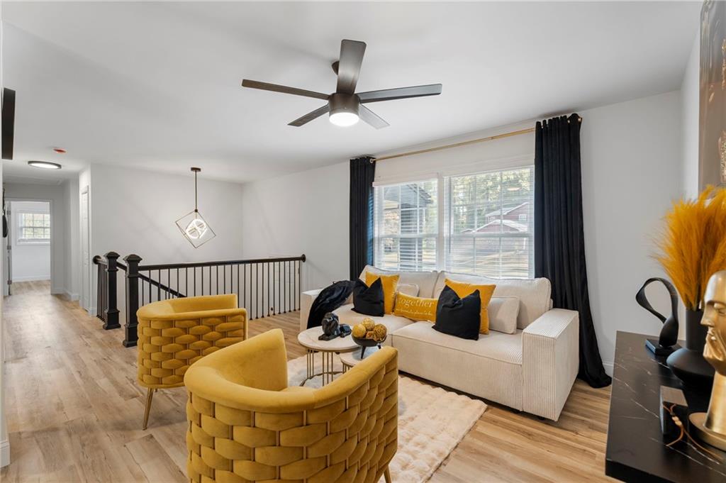 1969 Valley Ridge Drive Southwest Atlanta, GA 30331 - Photo 10 of 37 a living room with furniture and a large window