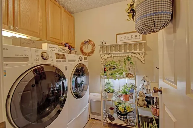 a utility room with multiple dryer and washer