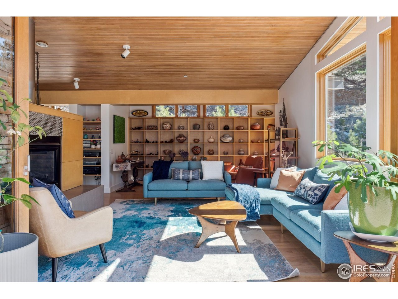1127 Valley Lane Boulder, CO 80302 - Photo 11 of 48 a living room with patio furniture and a floor to ceiling window