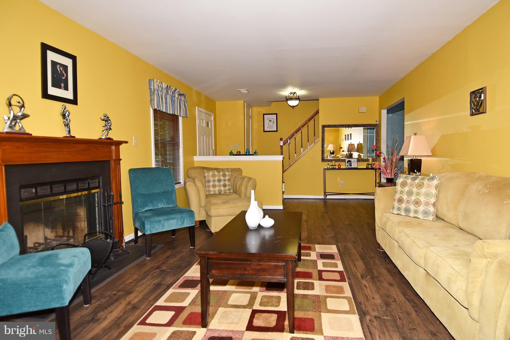 10313 Abbott Road Manassas, VA 20110 - Photo 3 of 30 a living room with furniture and a fireplace