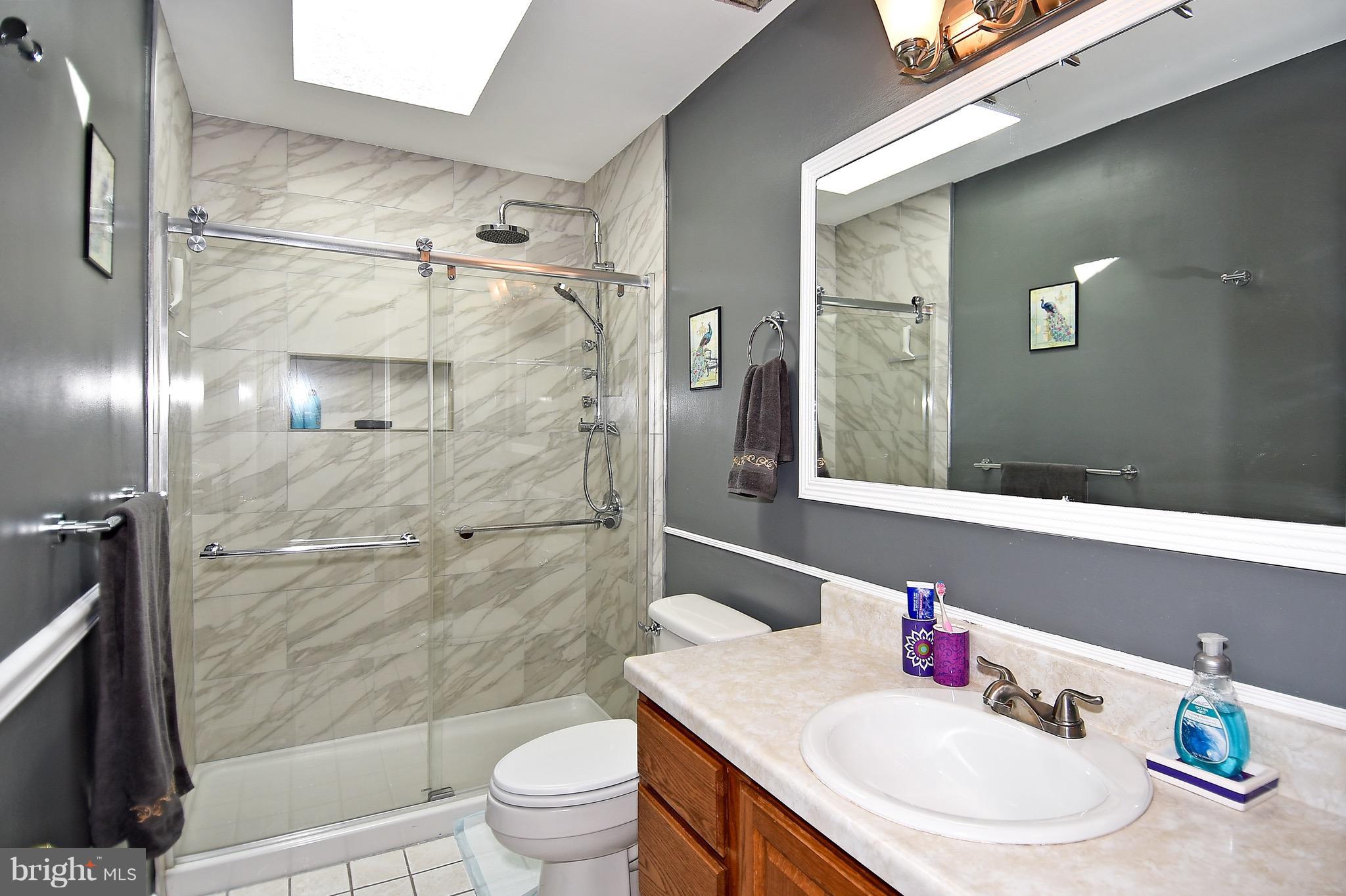10313 Abbott Road Manassas, VA 20110 - Photo 22 of 30 a bathroom with a sink toilet and shower