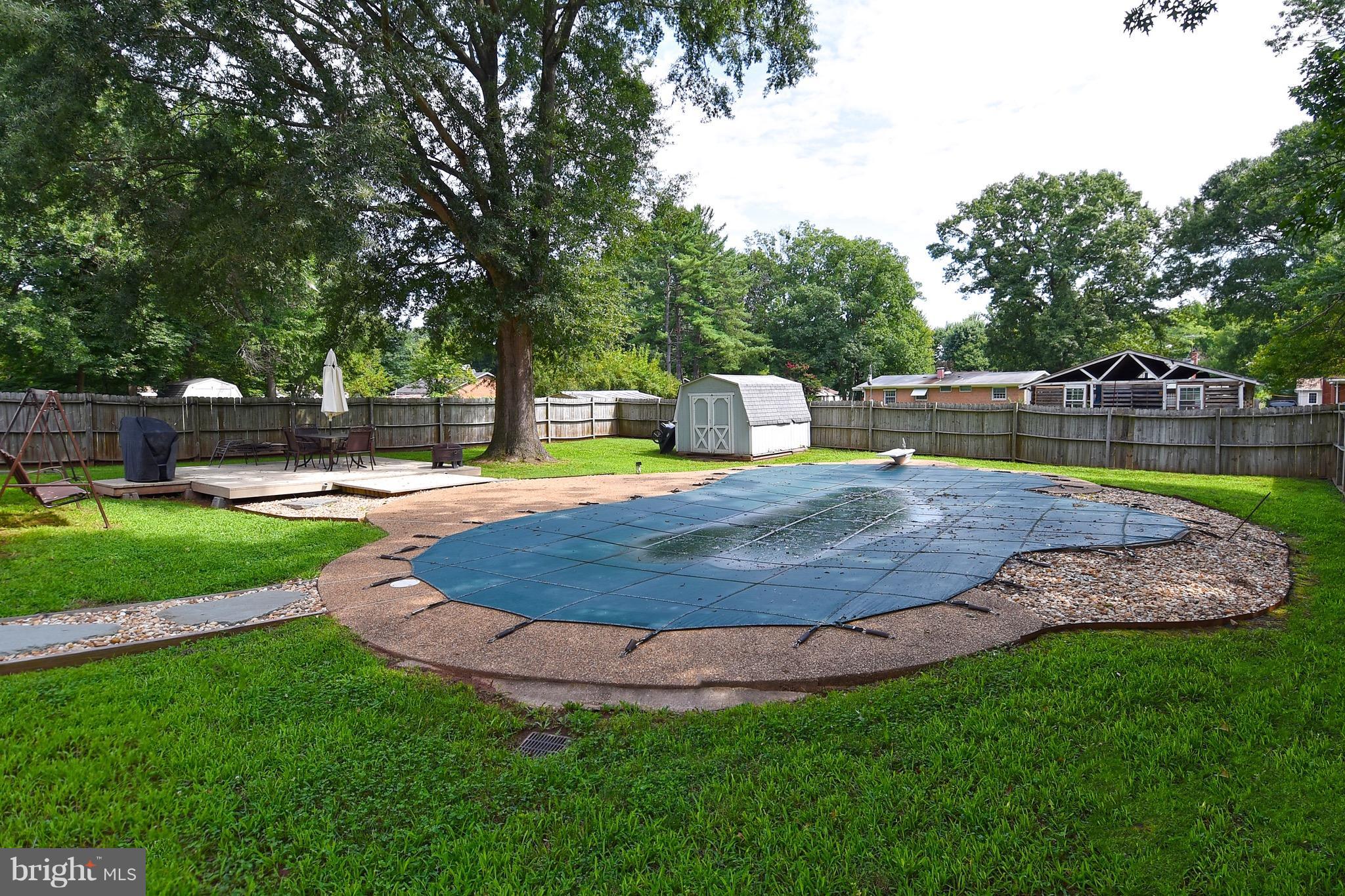 10313 Abbott Road Manassas, VA 20110 - Photo 25 of 30 a view of a swimming pool with a patio