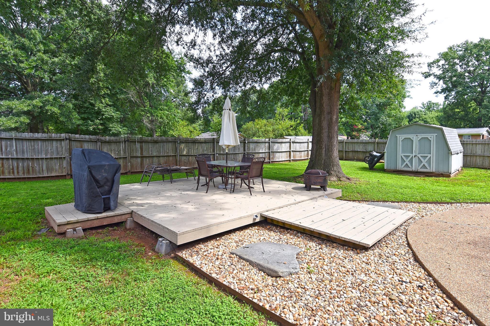 10313 Abbott Road Manassas, VA 20110 - Photo 26 of 30 a view of a backyard with sitting area