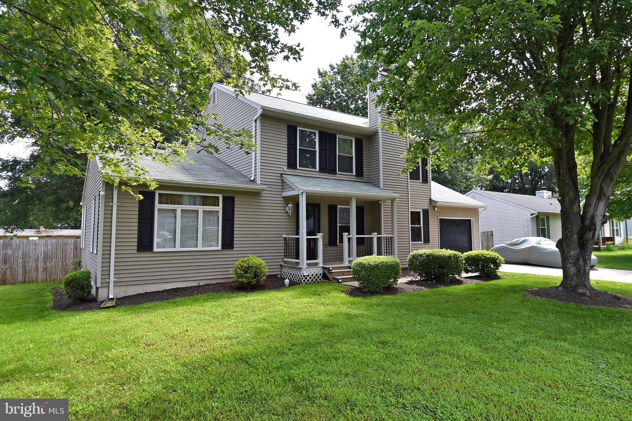 10313 Abbott Road Manassas, VA 20110 - Photo 30 of 30 a front view of a house with garden