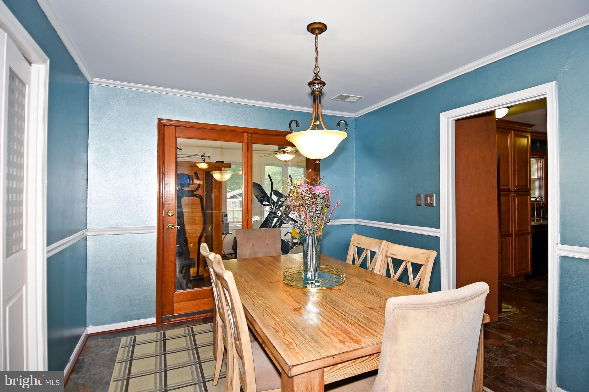 10313 Abbott Road Manassas, VA 20110 - Photo 10 of 30 a view of a dining room with furniture window and wooden floor