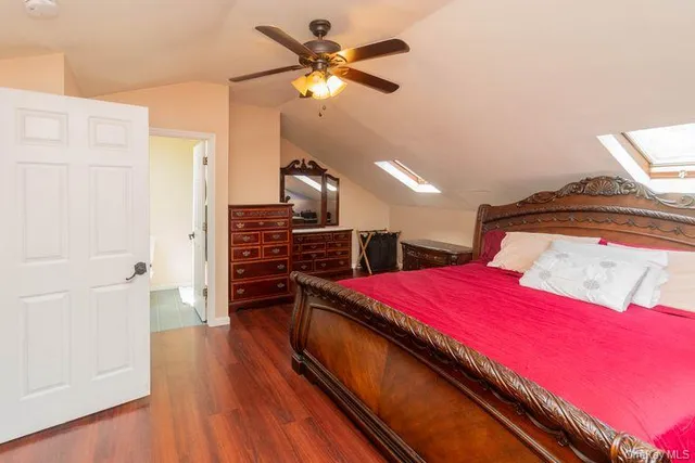 a bed room with a bed and a flat screen tv