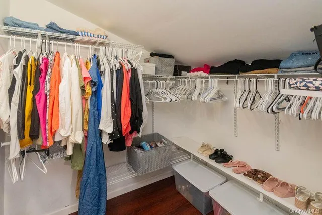 a bathroom with a toilet a sink and a mirror