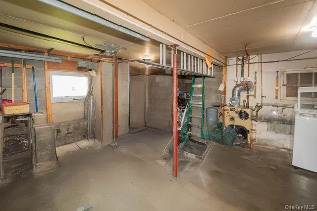 a utility room with multiple dryer and washer