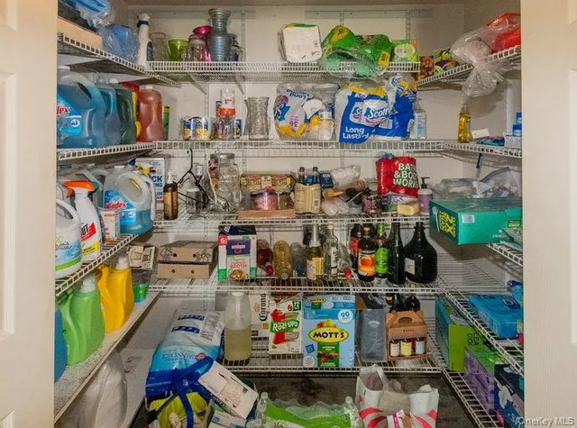 a view of a house with a yard and a chair