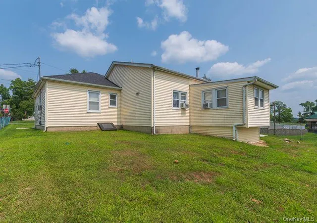 a front view of house with yard and seating area
