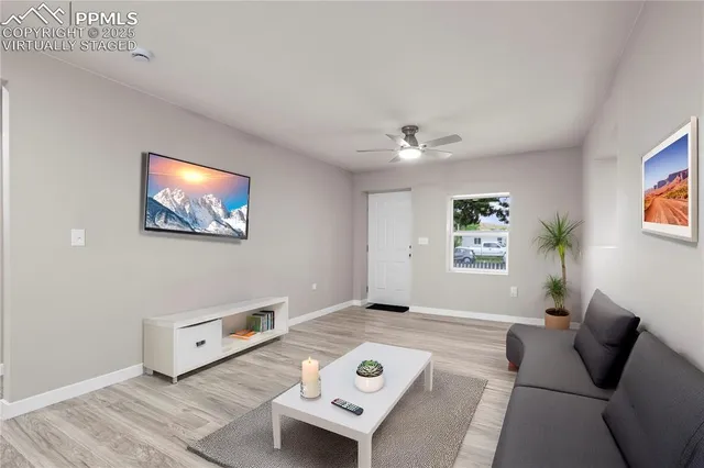 a living room with furniture and a window