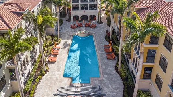 a view of outdoor space with lounge chairs