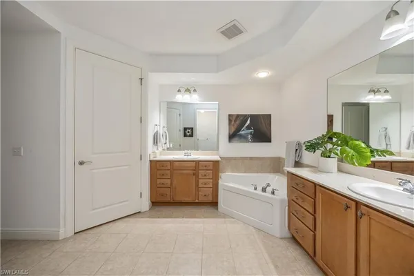 a bedroom with a bed and a television