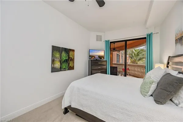 a bedroom with a bed and large cabinets