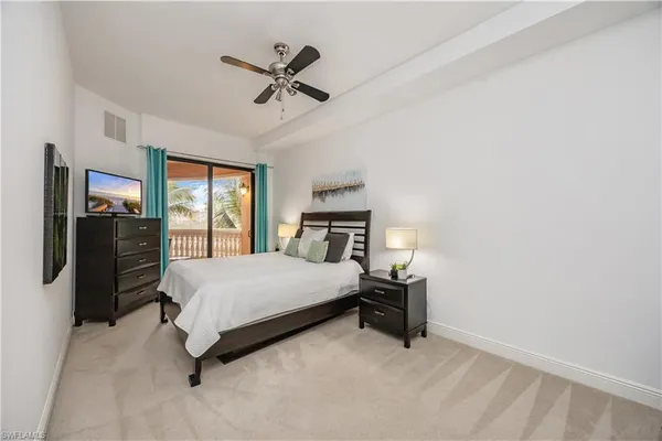 a large white bathroom with a granite countertop sink mirror and bathtub