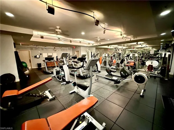 a living room with furniture a rug and a window
