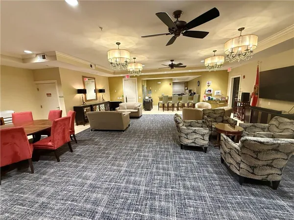 a view of a patio with a table and chairs under an umbrella