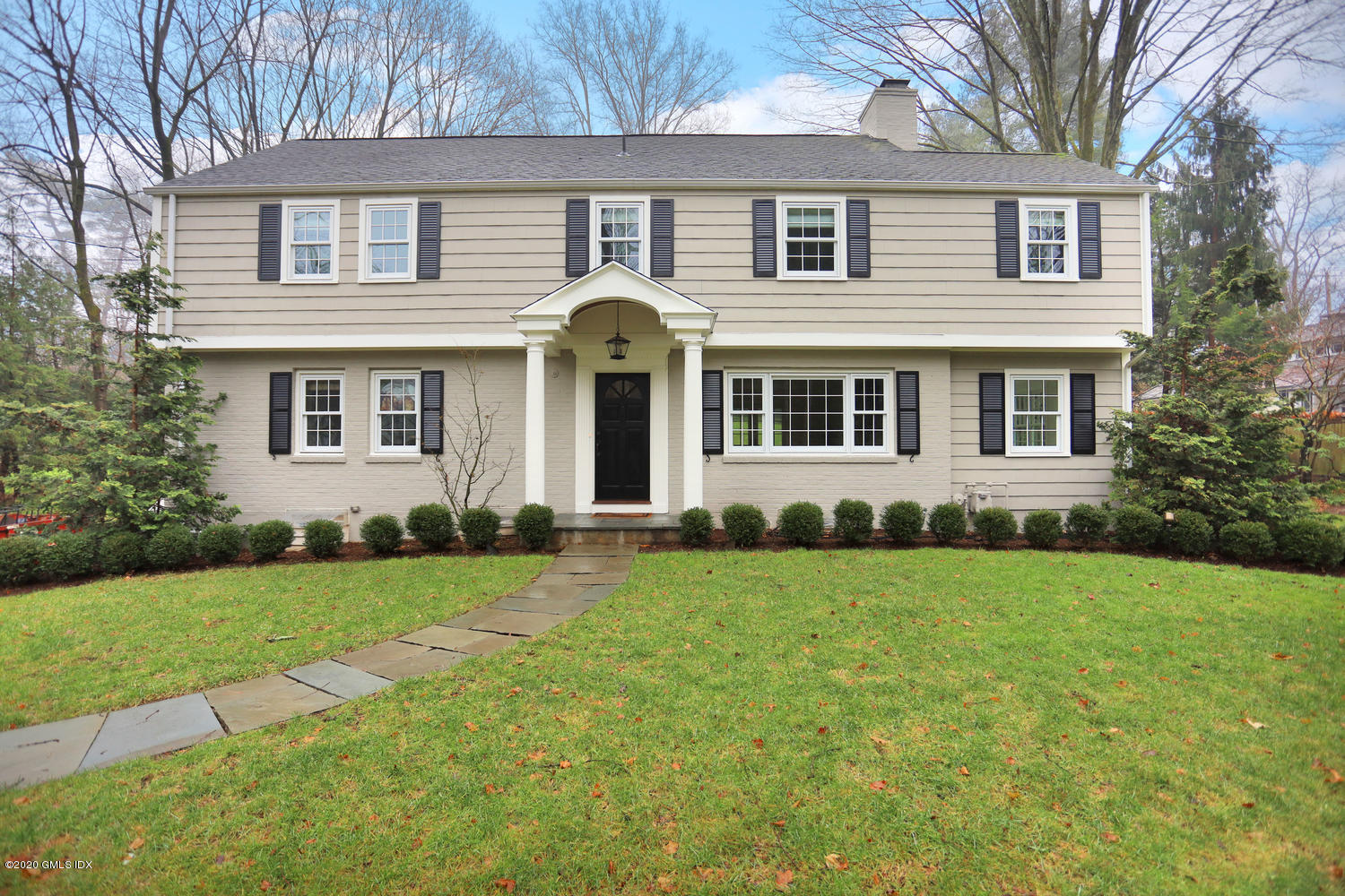 front view of a house with a yard