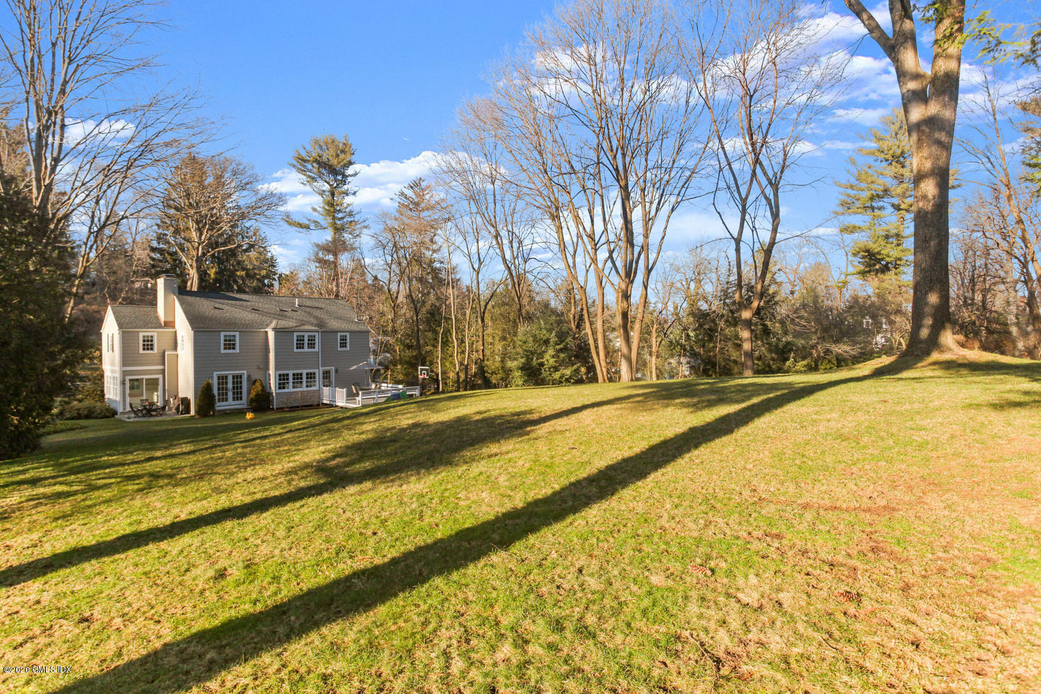 17 Hillside Drive Greenwich, CT 06830 - Photo 18 of 18 a view of swimming pool with large trees and wooden fence