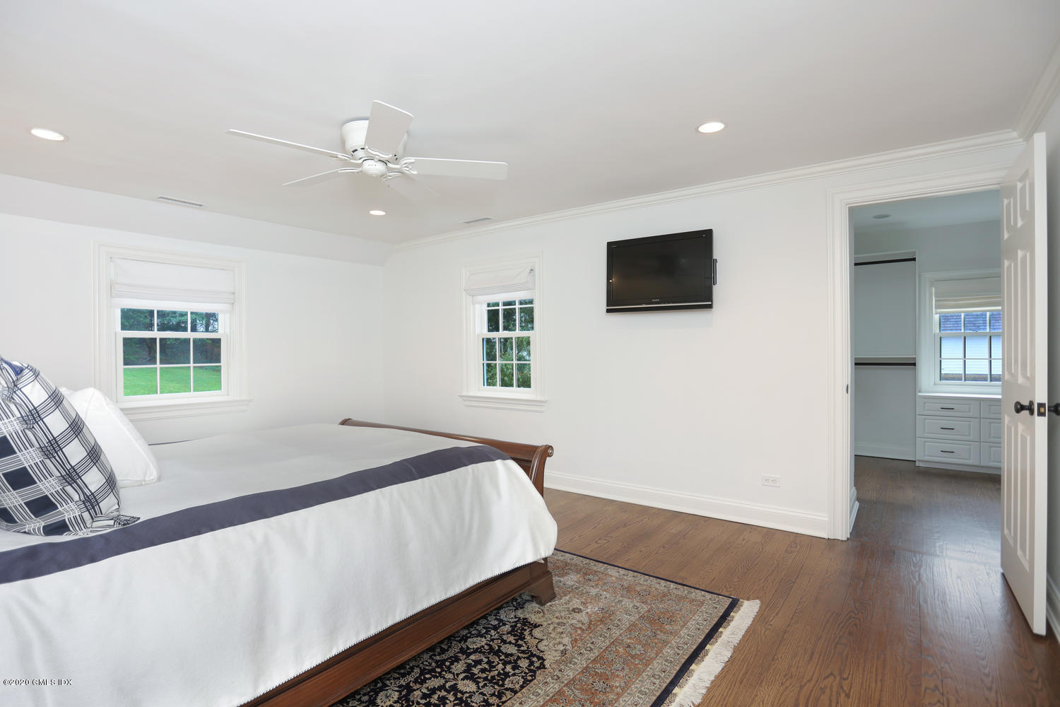 17 Hillside Drive Greenwich, CT 06830 - Photo 7 of 18 a bedroom with a bed and a flat screen tv