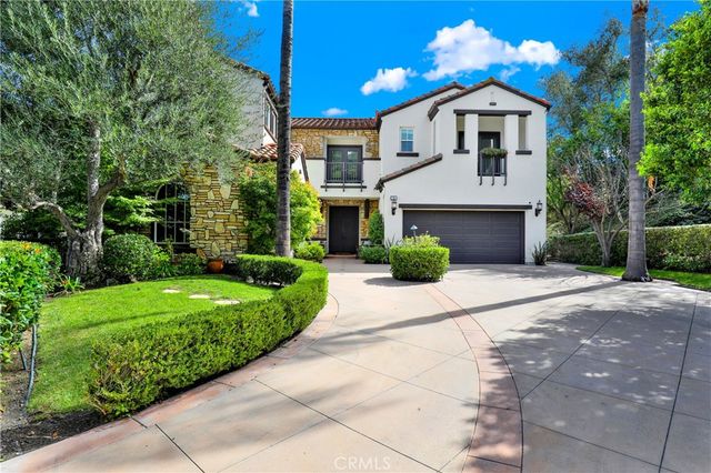 a large kitchen with a large counter top furniture appliances and living room view