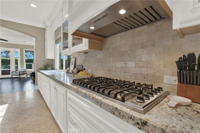 a view of a fire pit with potted plants