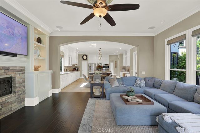 a view of a house with a big yard and potted plants