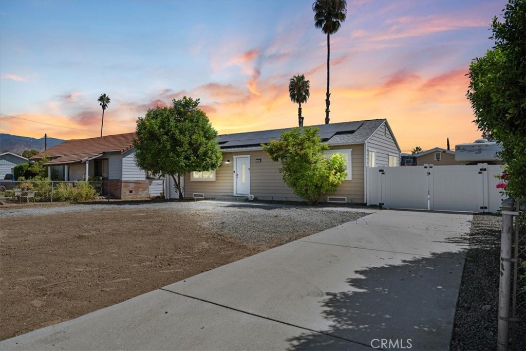 a front view of a house with a street