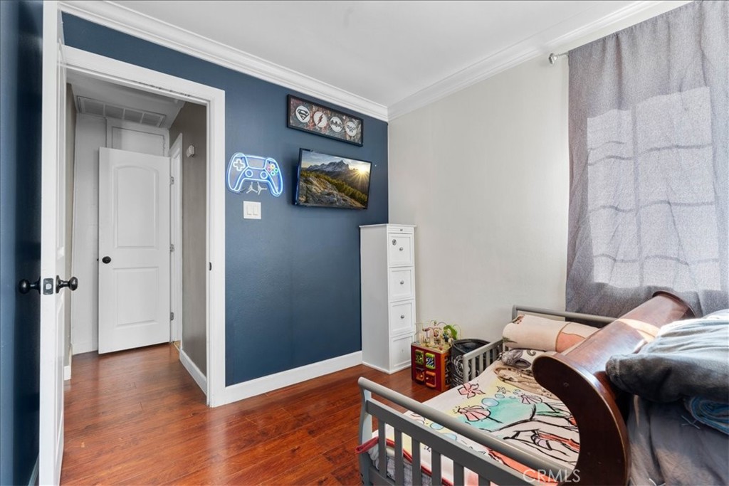 7167 Osbun Road San Bernardino, CA 92404 - Photo 2 of 35 a view of a workspace with furniture and wooden floor