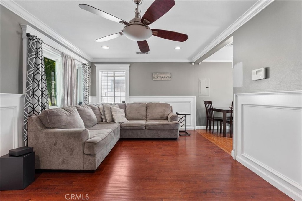 7167 Osbun Road San Bernardino, CA 92404 - Photo 22 of 35 a living room with furniture and a large window