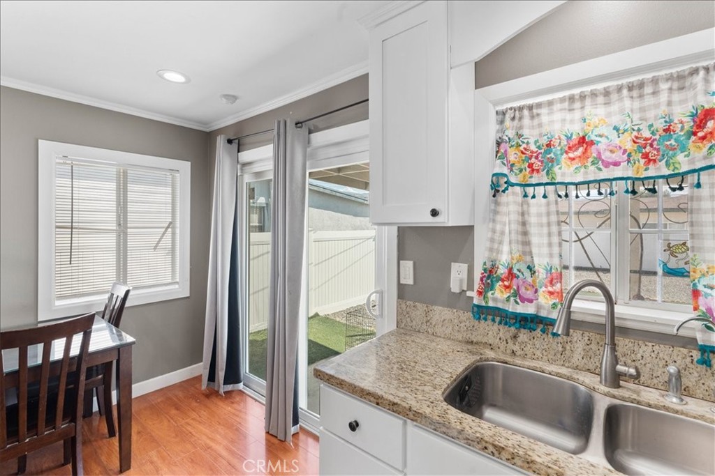 7167 Osbun Road San Bernardino, CA 92404 - Photo 25 of 35 a kitchen with stainless steel appliances granite countertop a sink and a granite counter tops with a large window