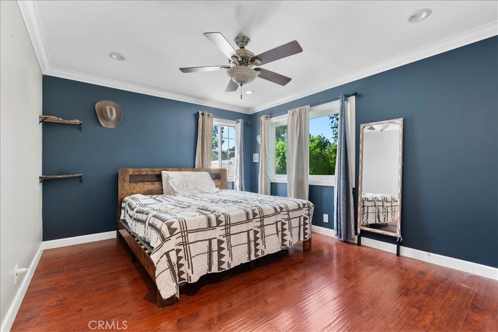 7167 Osbun Road San Bernardino, CA 92404 - Photo 30 of 35 a bedroom with a bed and window