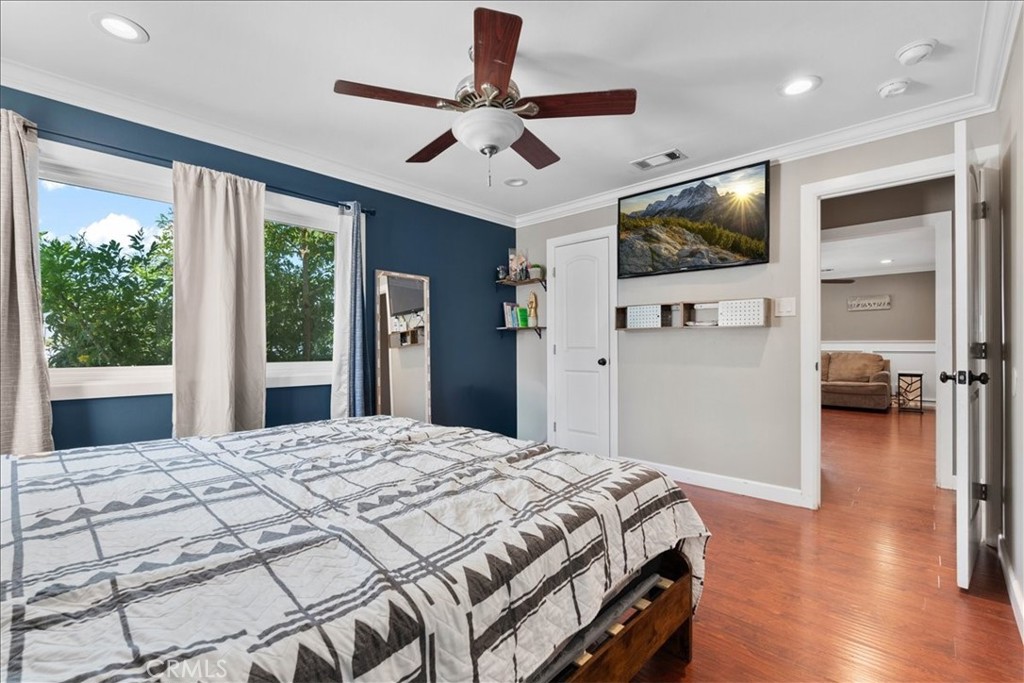 7167 Osbun Road San Bernardino, CA 92404 - Photo 31 of 35 a bedroom with a bed and a flat screen tv