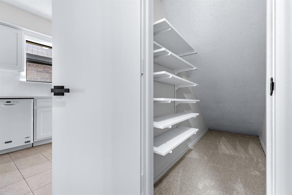 2543 Sundance Lane Dallas, TX 75287 - Photo 17 of 27 a view of an empty walk in closet