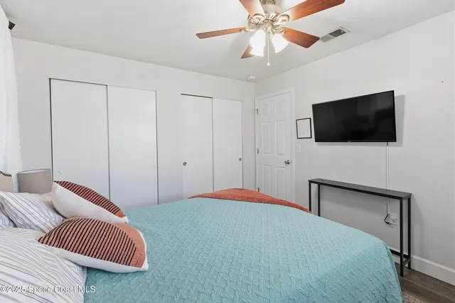 a kitchen with stainless steel appliances granite countertop a stove a kitchen island a dining table and chairs