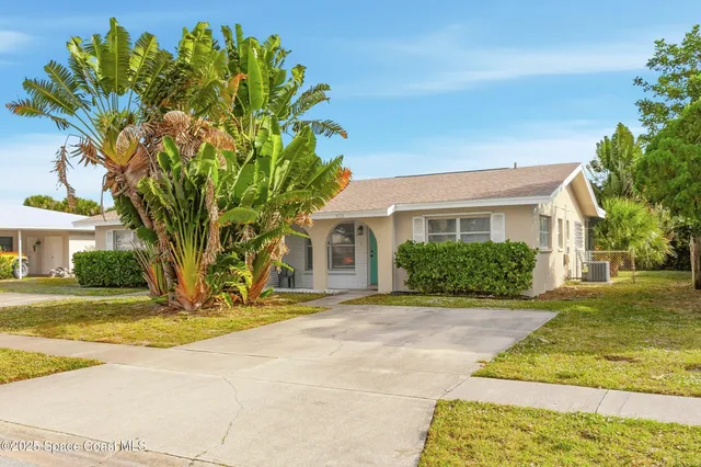 a view of a lake with beach and city view