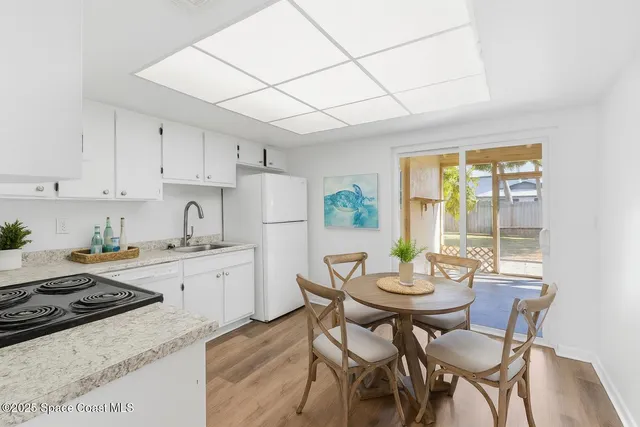 a view of a house with pool fire pit and outdoor space