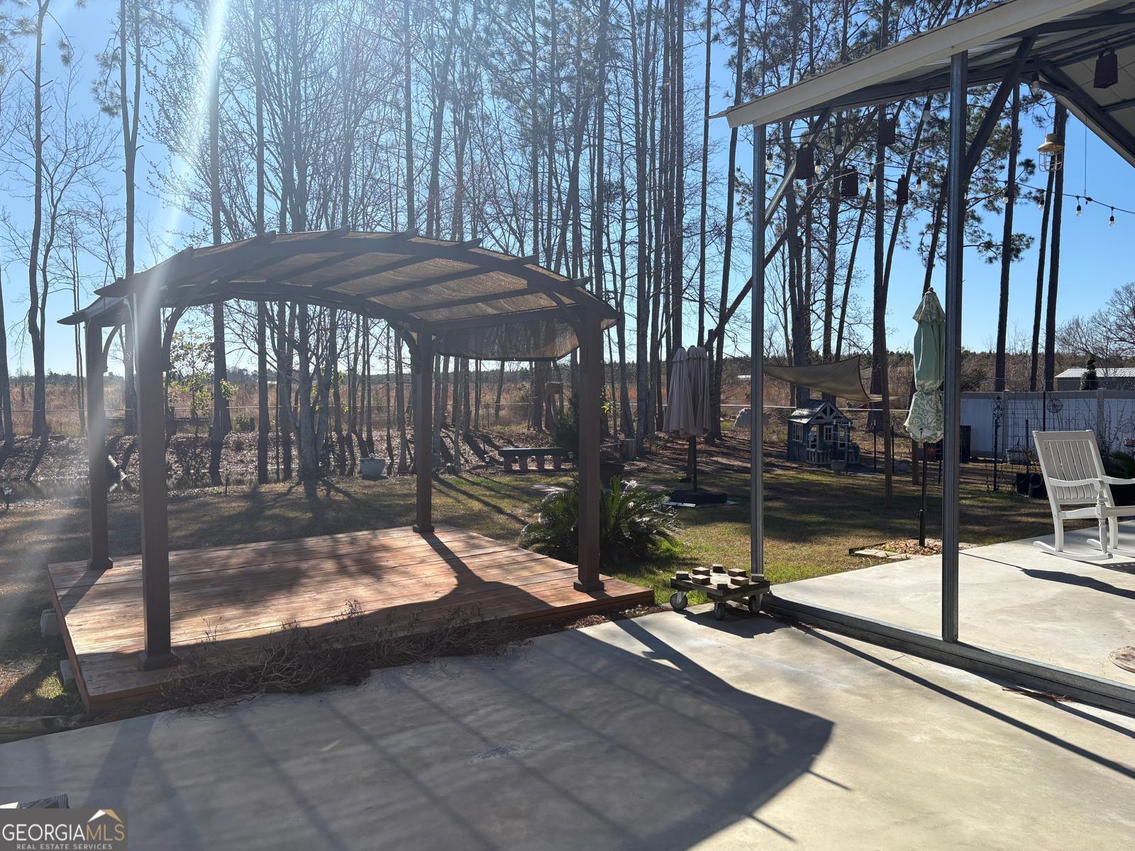 388 Forest Avenue Baxley, GA 31513 - Photo 23 of 28 a view of a backyard with sitting area