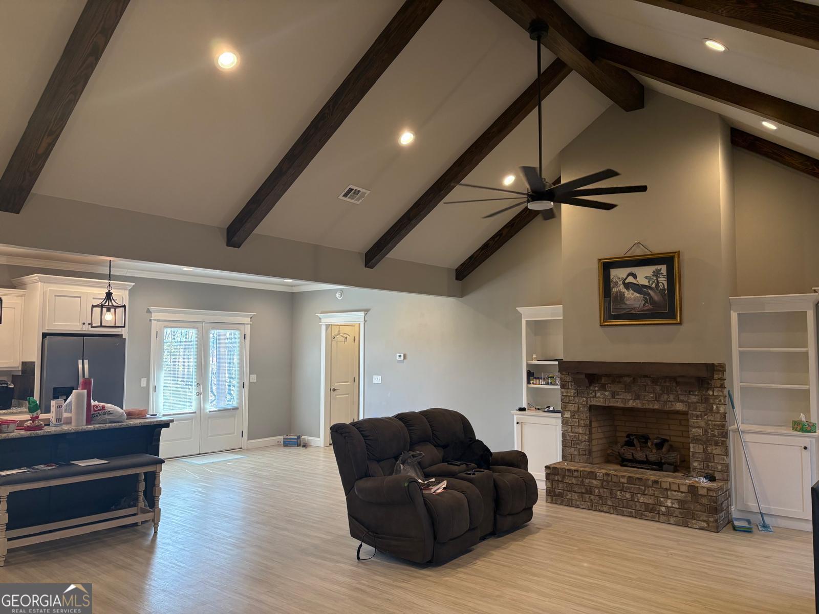 388 Forest Avenue Baxley, GA 31513 - Photo 5 of 28 a living room with furniture and a fireplace