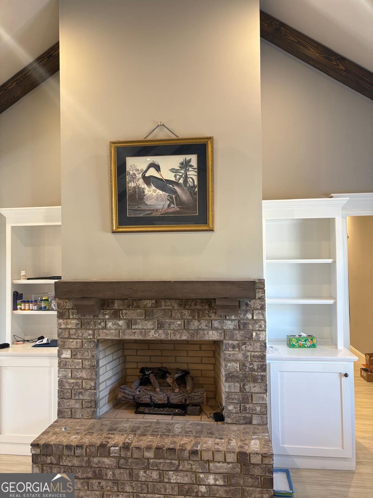 388 Forest Avenue Baxley, GA 31513 - Photo 9 of 28 a living room with a fireplace and a table