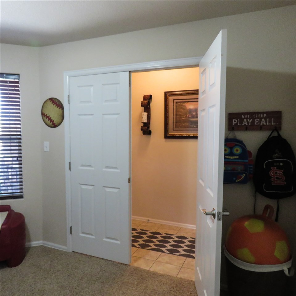 983 Kaley Street Fruita, CO 81521 - Photo 11 of 28 a bathroom with a sink and a mirror