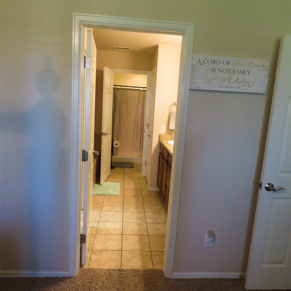 983 Kaley Street Fruita, CO 81521 - Photo 12 of 28 a view of a hallway with wooden floor