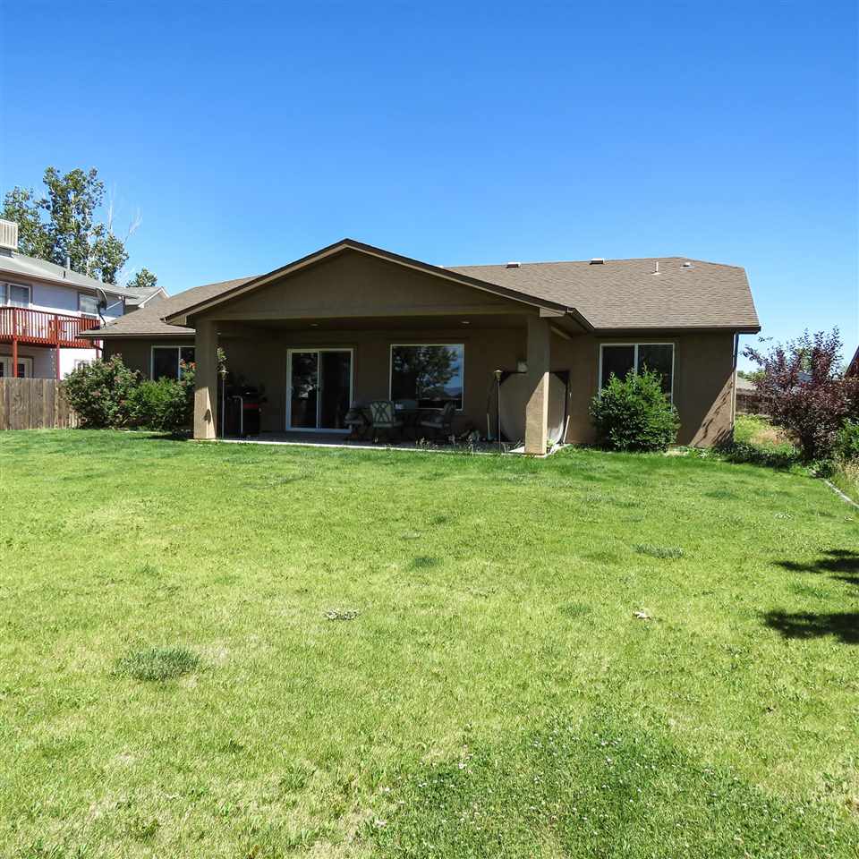983 Kaley Street Fruita, CO 81521 - Photo 14 of 28 a view of a house with yard and front view of a house